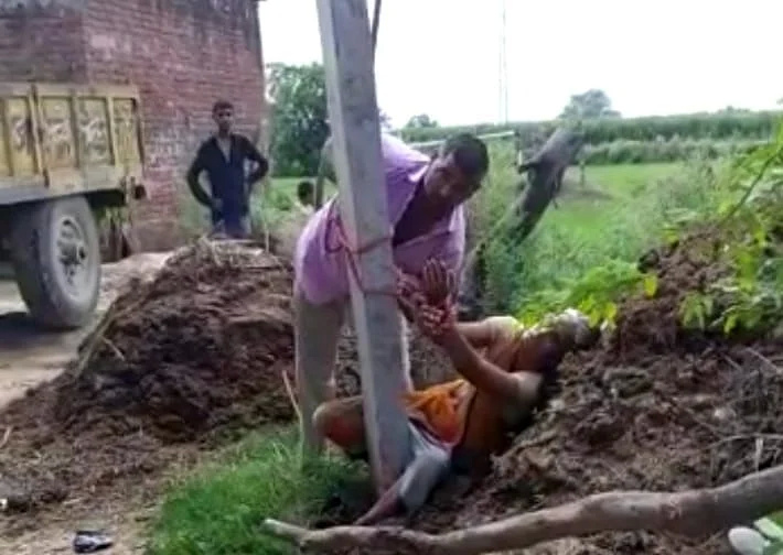 Husband beating wife tying in pillar