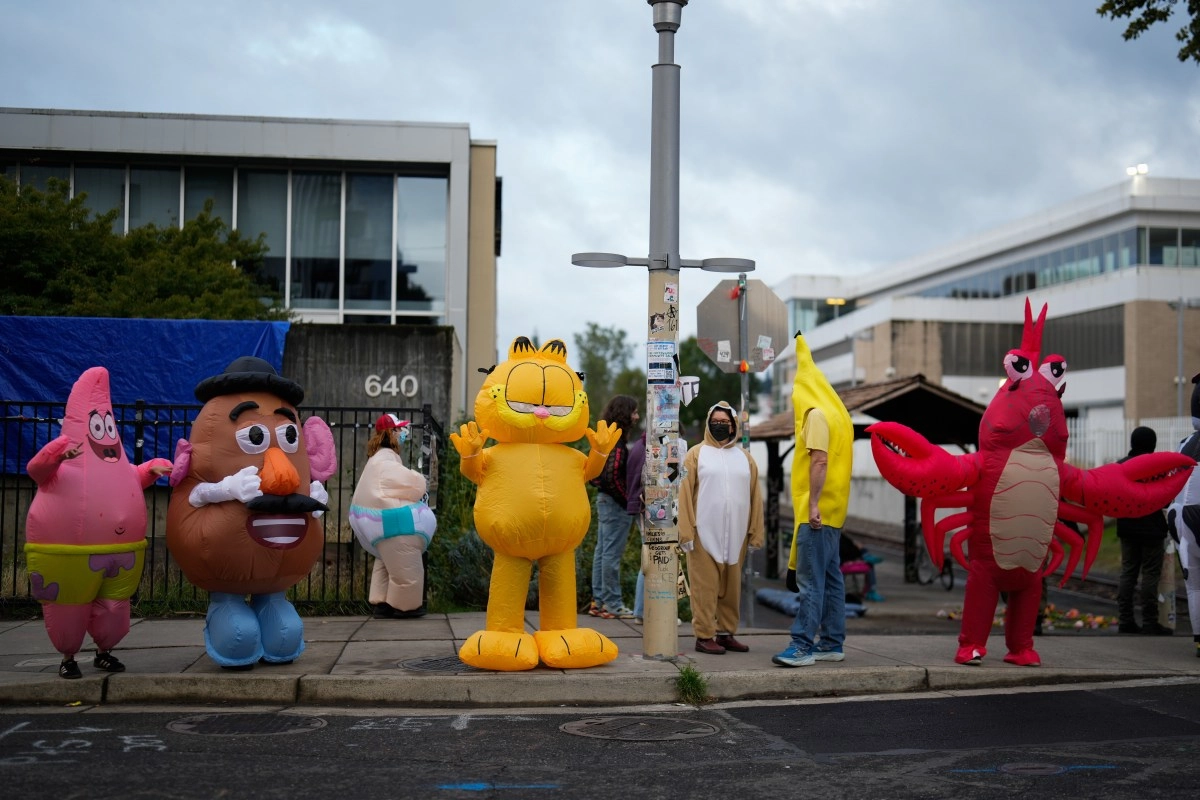 Costumed protesters in Portland challenge the city being a war zone