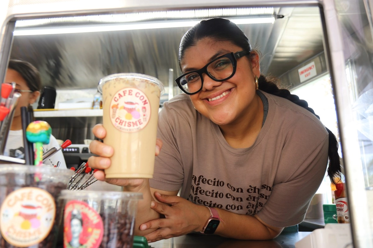 With a cup of coffee this Latina helps her family in Santa Ana
