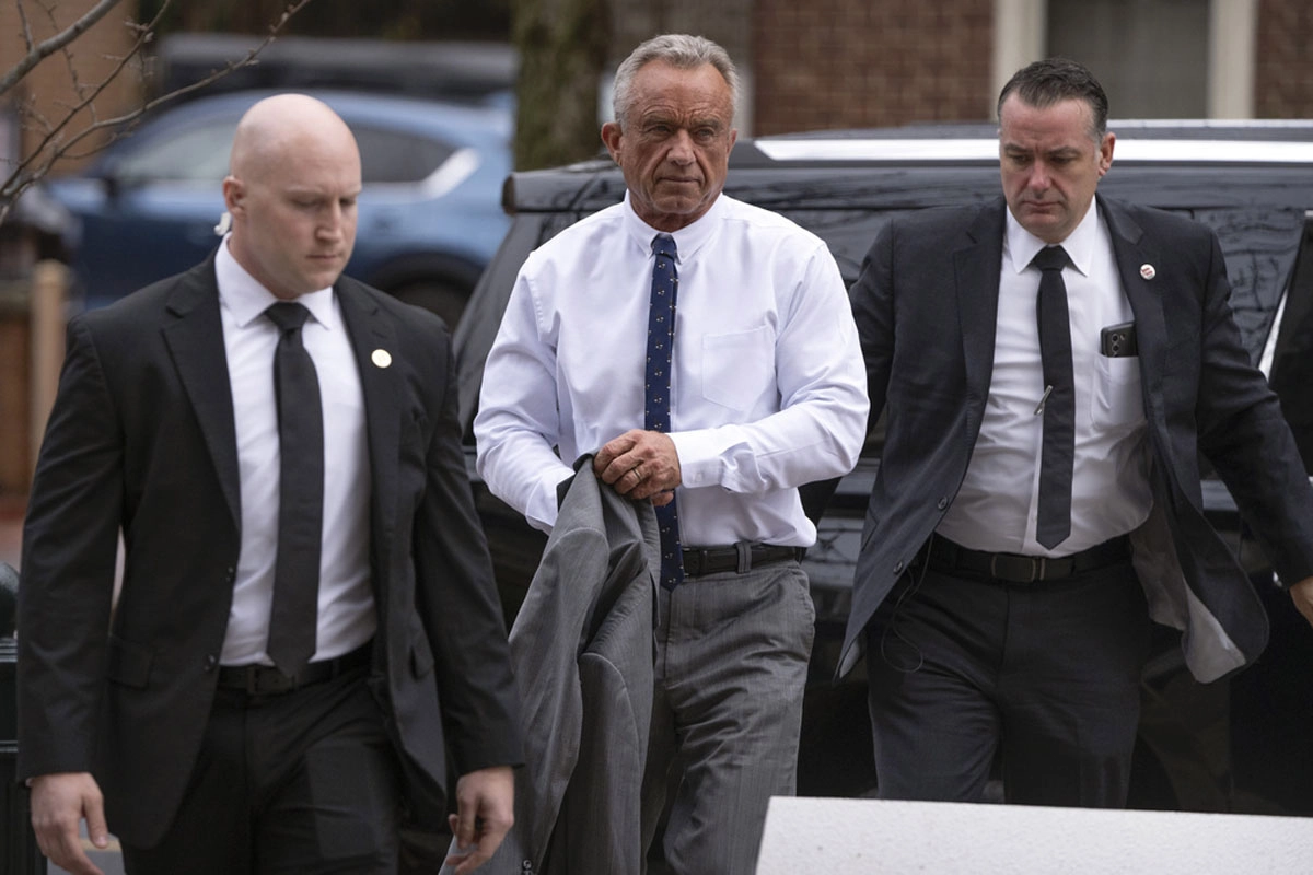 Kennedy Jr shows off his muscles in a controversial video next to singer Kid Rock