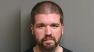 A Michigan man who strangled his ex-girlfriend and lived with her remains for 7 months was found guilty