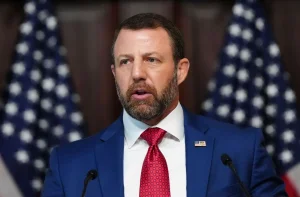 Mullin avoids responding to immigrant deaths and announces more ICE surveillance on the streets